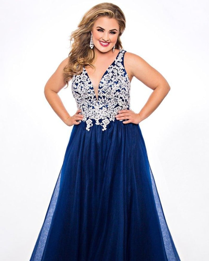 Front of a model wearing a size 26 Fairy Tale Formal Dress in Navy by Sydney's Closet. | dia_product_style_image_id:285917